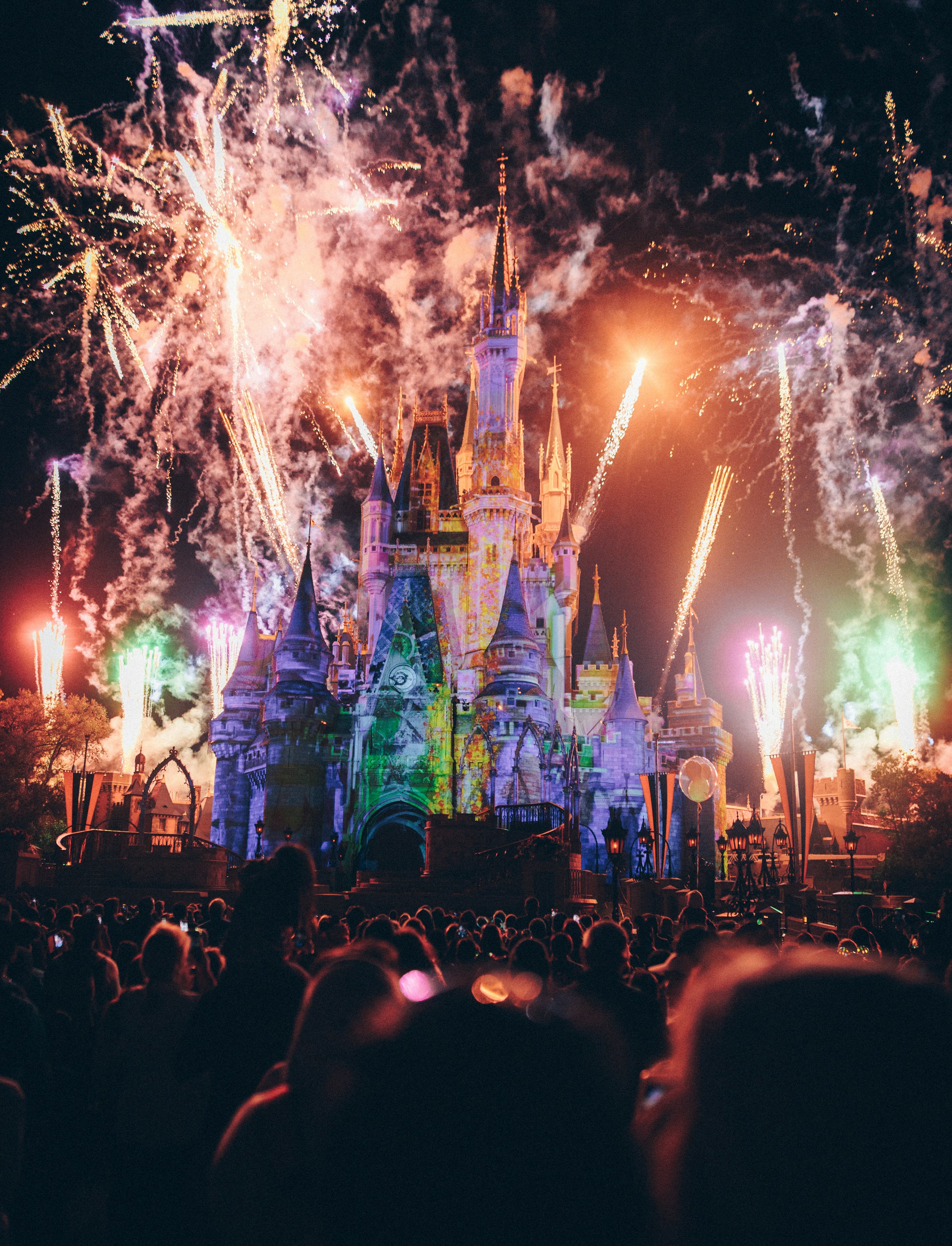 Cinderella Castle illuminated during a Disney fireworks show